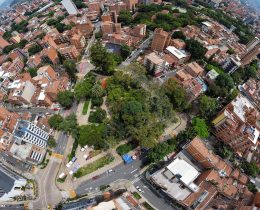 Medellin, Antioquia - Colombia. February 13, 2026. Aerial panoramic view of the city with a central park and tree-lined streets in the La Floresta neighborhood.